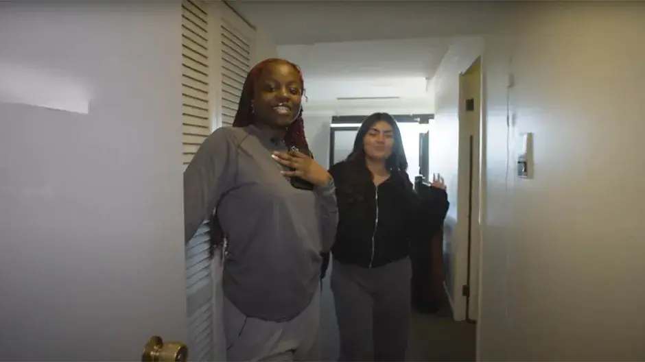 Two Creighton students showing efficiency room.